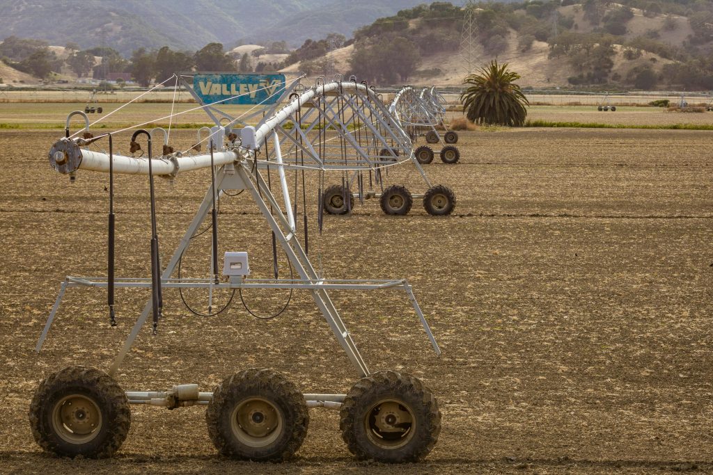 Long irrigation system on a farm field, illustrating modern agricultural methods.